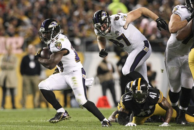 Oct 1, 2015; Pittsburgh, PA, USA; Baltimore Ravens running back Justin Forsett (29) runs the ball past Pittsburgh Steelers cornerback Antwon Blake (41) during the first half at Heinz Field. Mandatory Credit: Jason Bridge-USA TODAY Sports