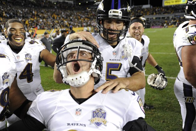 Baltimore Ravens kicker Justin Tucker (9), left, celebrates with quarterback Joe Flacco (5) after kicking the game winning field goal in overtime of an NFL football against the Pittsburgh Steelers, Thursday, Oct. 1, 2015 in Pittsburgh. (AP Photo/Don Wright)