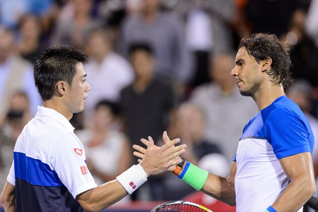 MONTREAL, ON - AUGUST 14:  Kei Nishikori of Japan shakes hands with Rafael Nadal of Spain after defeating him during day five of the Rogers Cup at Uniprix Stadium on August 14, 2015 in Montreal, Quebec, Canada.  Kei Nishikori defeated Rafael Nadal 6-2, 6-4.  (Photo by Minas Panagiotakis/Getty Images)