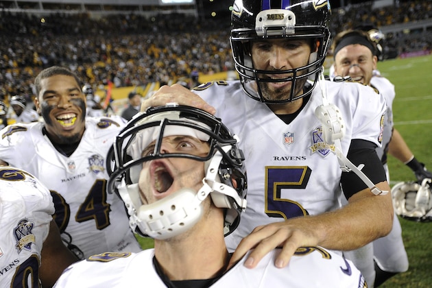 Baltimore Ravens kicker Justin Tucker (9), left, celebrates with quarterback Joe Flacco (5) after kicking the game winning field goal in overtime of an NFL football against the Pittsburgh Steelers, Thursday, Oct. 1, 2015 in Pittsburgh. (AP Photo/Don Wright)