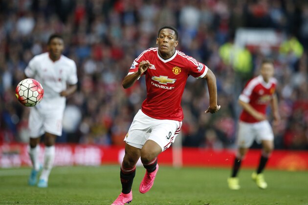 Manchester United's Anthony Martial races after the ball during the English Premier League soccer match between Manchester United and Liverpool at Old Trafford Stadium, Manchester, England, Saturday, Sept. 12, 2015. (AP Photo/Jon Super)