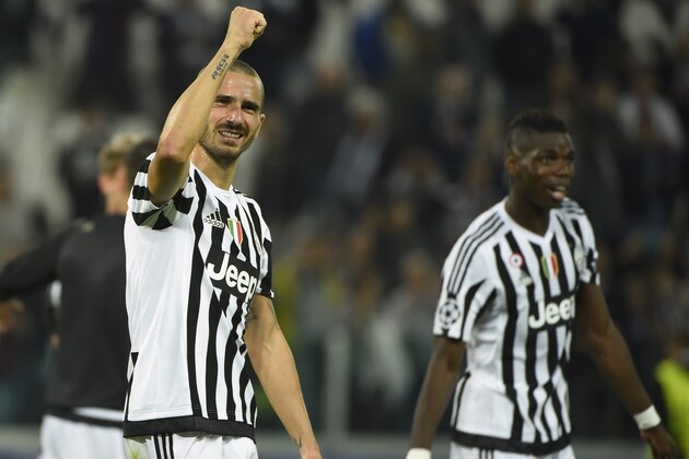 Juventus' midfielder from France Paul Pogba (R) and Juventus' defender from Italy Leonardo Bonucci celebrate at the end of the UEFA Champions League football match Juventus vs FC Sevilla on September 30 at the Juventus stadium in Turin. Juventus won 2-0.  AFP PHOTO / OLIVIER MORIN        (Photo credit should read OLIVIER MORIN/AFP/Getty Images)