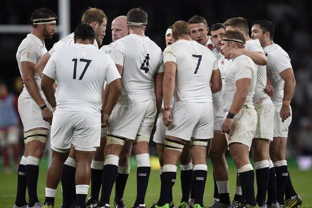 England's players huddle during a break due to an injury  on Wales' side during a Pool A match of the 2015 Rugby World Cup between England and Wales at Twickenham stadium, south west London, on September 26, 2015.  AFP PHOTO / FRANCK FIFE

RESTRICTED TO EDITORIAL USE, NO USE IN LIVE MATCH TRACKING SERVICES, TO BE USED AS NON-SEQUENTIAL STILLS        (Photo credit should read FRANCK FIFE/AFP/Getty Images)