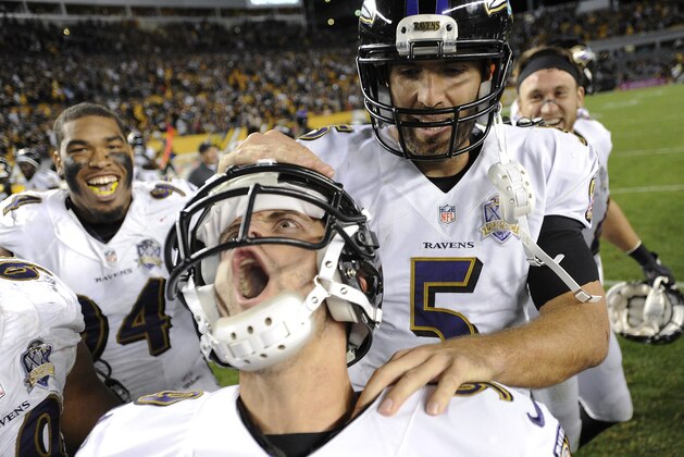 Baltimore Ravens kicker Justin Tucker (9), left, celebrates with quarterback Joe Flacco (5) after kicking the game winning field goal in overtime of an NFL football against the Pittsburgh Steelers, Thursday, Oct. 1, 2015 in Pittsburgh. (AP Photo/Don Wright)
