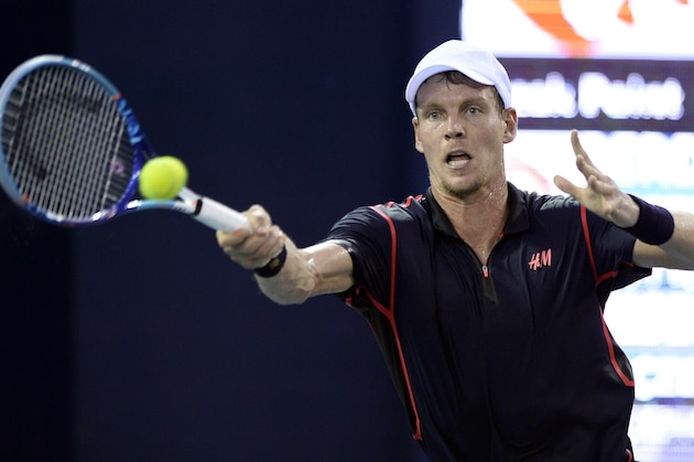 Tomas Berdych of the Czech Republic hits a return against Jiri Vesely of the Czech Republic during their quarter-final match at the Shenzhen Open tennis tournament in Shenzhen, in southern China's Guangdong province on October 2, 2015.      CHINA OUT    AFP PHOTO        (Photo credit should read STR/AFP/Getty Images)
