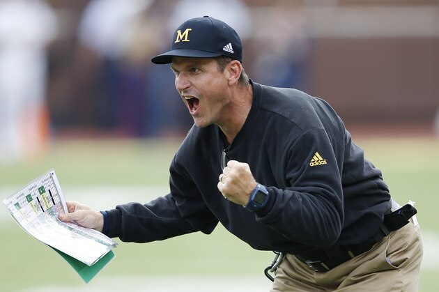 ANN ARBOR, MI - SEPTEMBER 26: Head coach Jim Harbaugh of the Michigan Wolverines celebrates a touchdown against the BYU Cougars during the game at Michigan Stadium on September 26, 2015 in Ann Arbor, Michigan. The Wolverines defeated the Cougars 31-0. (Photo by Joe Robbins/Getty Images)