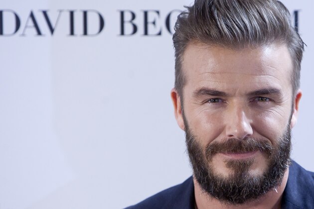 English former professional footballer David Beckham poses for the photographers during a presentation of his collaboration with a fashion clothing brand, on Friday, March 20, 2015. (AP Photo/Abraham Caro Marin)