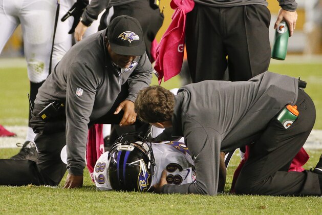 Baltimore Ravens wide receiver Steve Smith (89) is poked at by trainers after being injured in the third quarter of an NFL football game against the Pittsburgh Steelers, Thursday, Oct. 1, 2015 in Pittsburgh. (AP Photo/Gene J. Puskar)