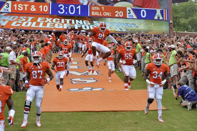 Clemson players run down the hill before the start of an NCAA college football  game against Appalachian State Saturday,  Sept. 12, 2015,  in Clemson, S.C. (AP Photo/Richard Shiro)