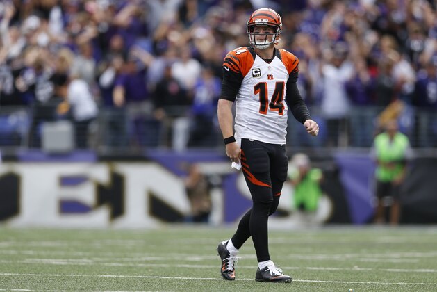 Cincinnati Bengals quarterback Andy Dalton (14) walks across the field during the second half of an NFL football game against the Baltimore Ravens in Baltimore, Sunday, Sept. 27, 2015. (AP Photo/Patrick Semansky)