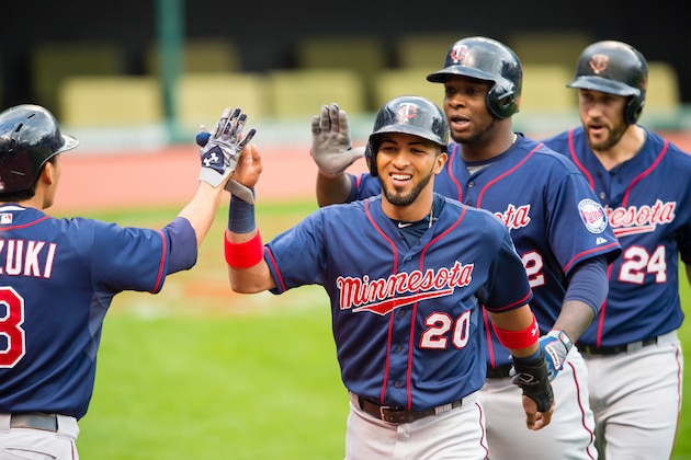 CLEVELAND, OH - SEPTEMBER 30: Kurt Suzuki #8 of the Minnesota Twins congratulates Eddie Rosario #20 Miguel Sano #22 and Trevor Plouffe #24 after they scored during the fourth inning against the Cleveland Indians at Progressive Field on September 30, 2015 in Cleveland, Ohio during game one of a doubleheader. (Photo by Jason Miller/Getty Images)