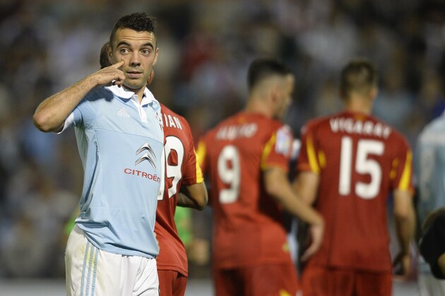 Celta Vigo's forward Iago Aspas gestures during the Spanish league football match Celta Vigo vs Getafe CF at the Balaidos stadium in Vigo on October 2, 2015.   AFP PHOTO / MIGUEL RIOPA        (Photo credit should read MIGUEL RIOPA/AFP/Getty Images)