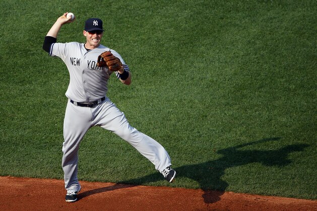 New York Yankees second baseman Stephen Drew leaves hi sweet to throw out Boston Red Sox's Travis Shaw during the first inning of a baseball game at Fenway Park in Boston Wednesday, Sept. 2, 2015. (AP Photo/Winslow Townson)