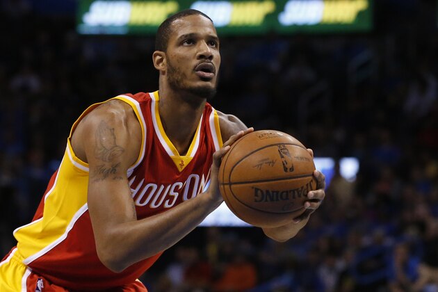 Houston Rockets forward Trevor Ariza (1) shoots a foul shot during an NBA basketball game between the Houston Rockets and the Oklahoma City Thunder in Oklahoma City, Sunday, April 5, 2015. Houston won 115-112. (AP Photo/Sue Ogrocki)