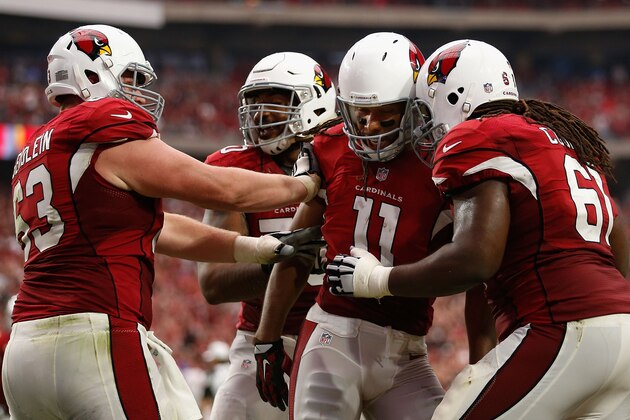 GLENDALE, AZ - SEPTEMBER 27:  Wide receiver Larry Fitzgerald #11 (C) of the Arizona Cardinals celebrates with Lyle Sendlein #63 and Jonathan Cooper #61 after catching a touchdown reception against the San Francisco 49ers during the NFL game at the University of Phoenix Stadium on September 27, 2015 in Glendale, Arizona. The Carindals defeated the 49ers 47-7.  (Photo by Christian Petersen/Getty Images)