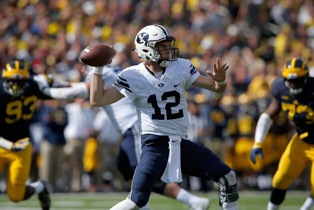 ANN ARBOR, MI - SEPTEMBER 26:  Quarterback Tanner Mangum #12 of the Brigham Young Cougars delivers a pass against the Michigan Wolverines at Michigan Stadium on September 26, 2015 in Ann Arbor, Michigan. The Wolverines defeated the Cougars 31-0.  (Photo by Doug Pensinger/Getty Images)