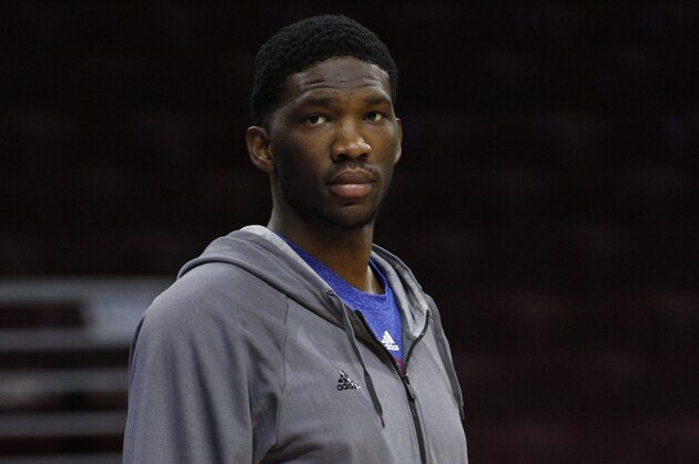 Philadelphia 76ers' Joel Embiid of Cameroon looks on during warm-ups prior to the first half of an NBA basketball game against the Brooklyn Nets, Wednesday, Nov. 26, 2014, in Philadelphia. (AP Photo/Chris Szagola)