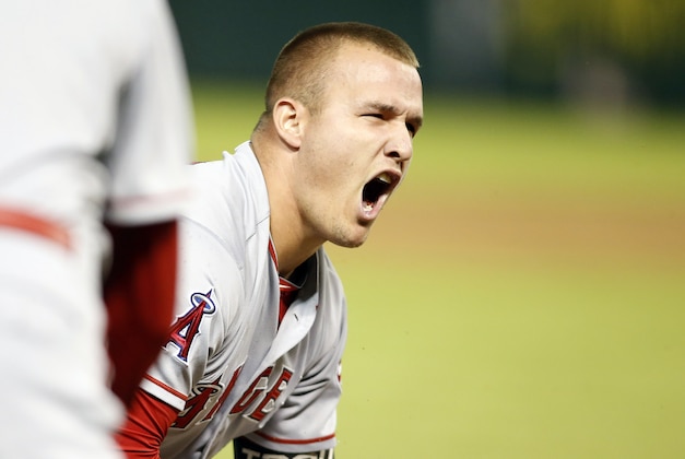 Oct 2, 2015; Arlington, TX, USA; Los Angeles Angels center fielder Mike Trout (27) reacts to hitting a triple in the ninth inning against the Texas Rangers at Globe Life Park in Arlington. Los Angeles won 2-1. Mandatory Credit: Tim Heitman-USA TODAY Sports