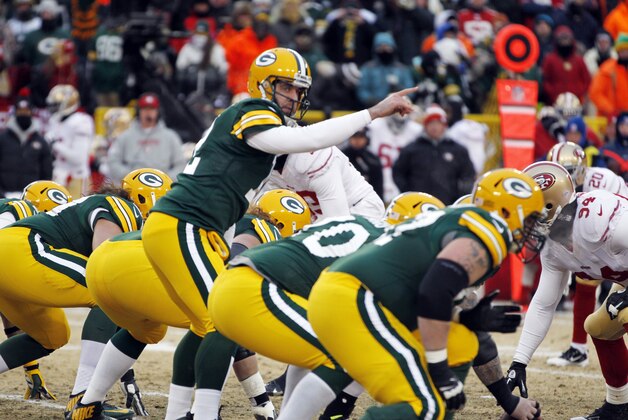 Green Bay Packers quarterback Aaron Rodgers (12) calls a play during the first half of an NFL wild-card playoff football game against the San Francisco 49ers, Sunday, Jan. 5, 2014, in Green Bay, Wis. (AP Photo/Kiichiro Sato)