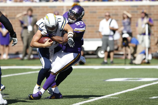 Minnesota Vikings defensive end Everson Griffen (97) sacks San Diego Chargers quarterback Philip Rivers (17) in the first half of an NFL football game in Minneapolis, Sunday, Sept. 27, 2015.  (AP Photo/Jim Mone)