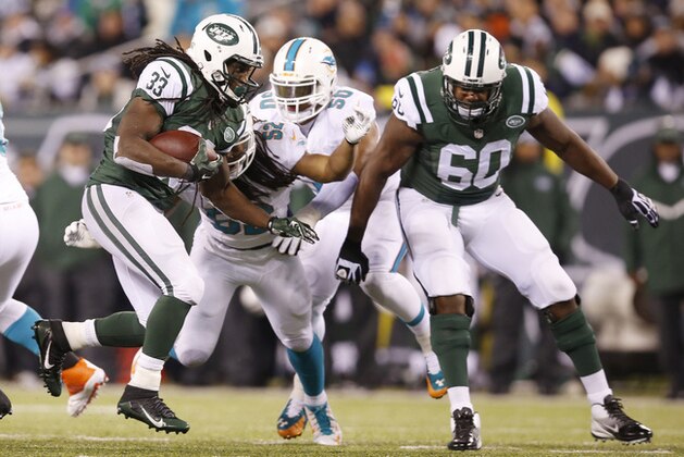 New York Jets running back Chris Ivory (33) runs the ball against the Miami Dolphins during the third quarter of an NFL football game, Monday, Dec. 1, 2014, in East Rutherford, N.J. (AP Photo/Kathy Willens)