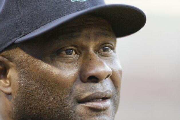 Seattle Mariners manager Lloyd McClendon looks on from the dugout during a baseball game against the Texas Rangers in Arlington, Texas, Friday, Sept. 18, 2015. (AP Photo/LM Otero)