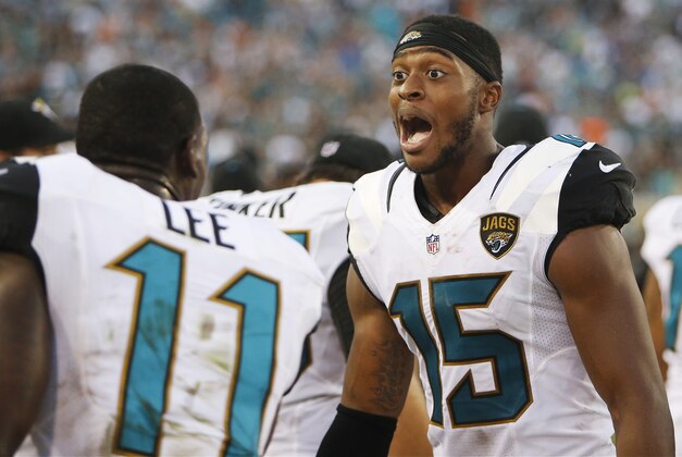 Jacksonville Jaguars wide receiver Allen Robinson (15) celebrates on the sidelines after the second half of an NFL football game against the Miami Dolphins, Sunday, Sept. 20, 2015, in Jacksonville, Fla. The Jacksonville Jaguars won 23-20. (AP Photo/Stephen B. Morton)
