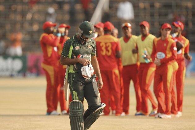 Pakistan batsman Wahab Riaz walks off the pitch after been run out during the One Day International Cricket match between Zimbabwe and Pakistan in Harare, Saturday, Oct. 3, 2015.(AP Photo/Tsvangirayi Mukwazhi)