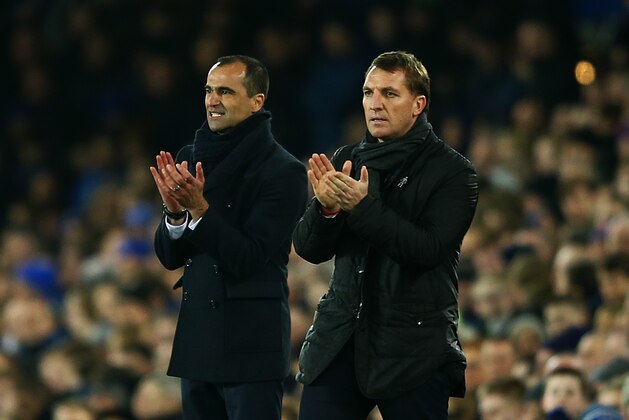 LIVERPOOL, ENGLAND - FEBRUARY 07:  Brendan Rodgers, manager of Liverpool and Roberto Martinez, manager of Everton applaud their players during the Barclays Premier League match between Everton and Liverpool at Goodison Park on February 7, 2015 in Liverpool, England.  (Photo by Richard Heathcote/Getty Images)
