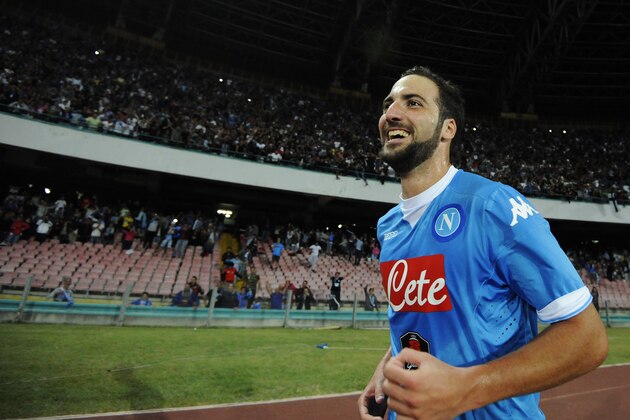 Napoli's Gonzalo Higuain celebrates after scoring during a Serie A soccer match between Napoli and Juventus, at the San Paolo stadium in Naples, Italy, Saturday, Sept. 26, 2015. (AP Photo/Salvatore Laporta)