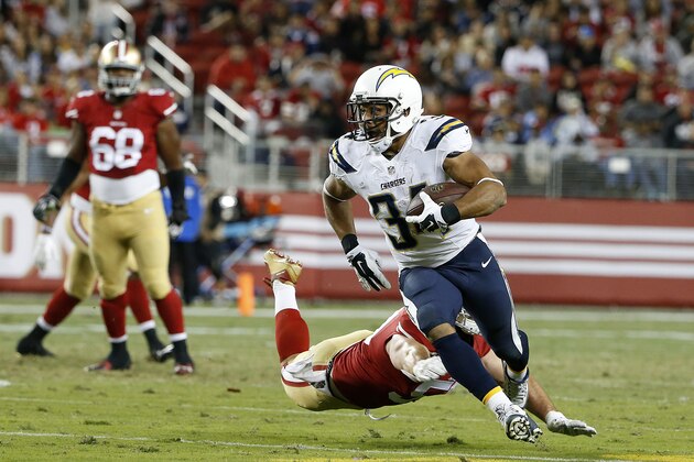 San Diego Chargers running back Donald Brown (34) runs past San Francisco 49ers linebacker Nick Bellore during the second half of an NFL preseason football game in Santa Clara, Calif., Thursday, Sept. 3, 2015. (AP Photo/Tony Avelar)