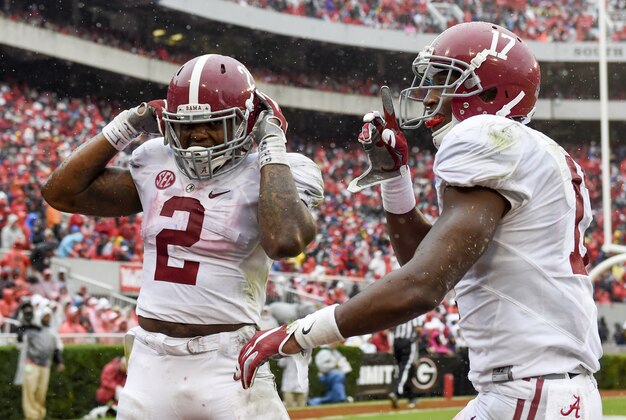 Oct 3, 2015; Athens, GA, USA; Alabama Crimson Tide running back Derrick Henry (2) and running back Kenyan Drake (17) celebrate a touchdown by Henry during the second quarter against the Georgia Bulldogs at Sanford Stadium. Mandatory Credit: John David Mercer-USA TODAY Sports