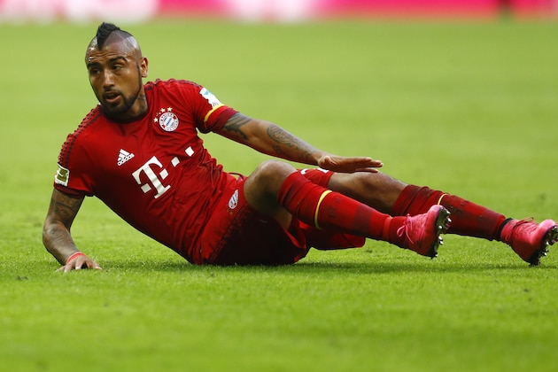 Bayern's Arturo Vidal lies on the ground during the German Bundesliga soccer match between FC Bayern Munich and Bayer Leverkusen 04 in Munich, Germany, Saturday, Aug. 29, 2015. (AP Photo/Matthias Schrader)