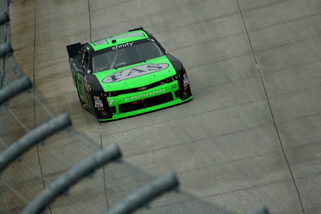 DOVER, DE - OCTOBER 03:  Regan Smith, driver of the #7 Fire Alarm Services Chevrolet, races during the NASCAR XFINITY Series Hisense 200 at Dover International Speedway on October 3, 2015 in Dover, Delaware.  (Photo by Patrick Smith/Getty Images)