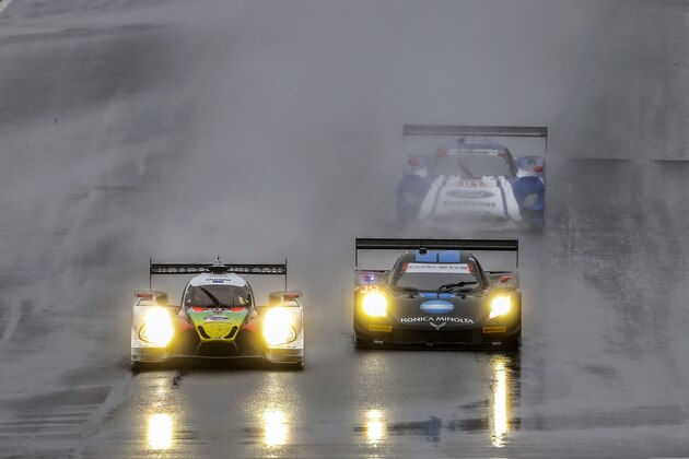 BRASELTON, GA - OCTOBER 03:  The #60 Honda Ligier Justin Wilson tribute car of John Pew,  Oswaldo Negri Jr. and Matt McMurry leads the #10 Corvette DP of Ricky Taylor, Jordan Taylor and Max Angelelli and the #01 Ford Riley of Scott Pruett, Joey Hand and Scott Dixon in the rain during the Petit Le Mans IMSA Tudor Series race at Road Atlanta on October 3, 2015 in Braselton, Georgia.  (Photo by Brian Cleary/Getty Images)