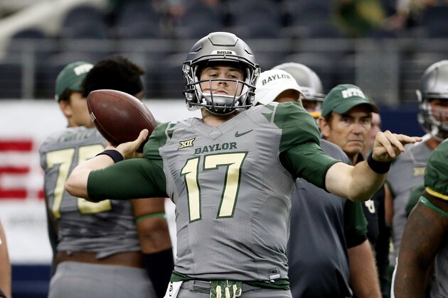Baylor quarterback Seth Russell (17) passes during warm ups before an NCAA college football game against Texas Tech Saturday, Oct. 3, 2015, in Arlington, Texas. (AP Photo/Tony Gutierrez)