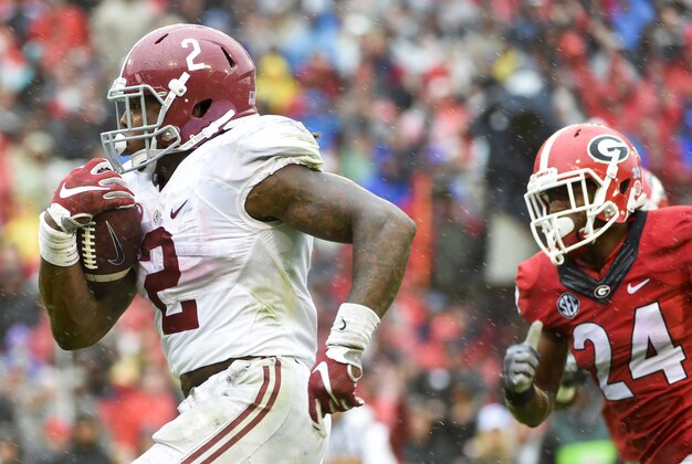 Oct 3, 2015; Athens, GA, USA; Alabama Crimson Tide running back Derrick Henry (2) runs the ball past Georgia Bulldogs safety Dominick Sanders (24) for a touchdown during the second quarter at Sanford Stadium. Mandatory Credit: John David Mercer-USA TODAY Sports