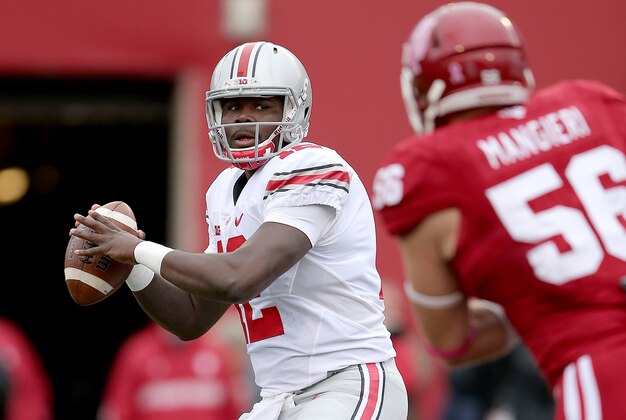 Oct 3, 2015; Bloomington, IN, USA; Ohio State Buckeyes quarterback Cardale Jones (12) passes on the Indiana Hoosiers defense in the first half of their game at Memorial Stadium. Mandatory Credit: Matt Kryger-USA TODAY Sports
