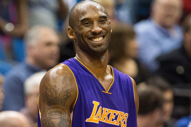 Dec 14, 2014; Minneapolis, MN, USA; Los Angeles Lakers guard Kobe Bryant (24) laughs against the Minnesota Timberwolves at Target Center. The Lakers defeated the Timberwolves 100-94. Mandatory Credit: Brace Hemmelgarn-USA TODAY Sports