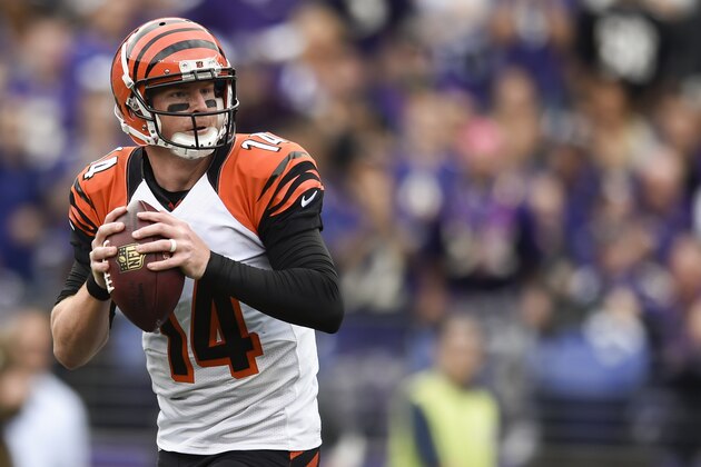 Cincinnati Bengals quarterback Andy Dalton (14) looks for an open man during the second half of an NFL football game against the Baltimore Ravens in Baltimore, Sunday, Sept. 27, 2015. (AP Photo/Gail Burton)