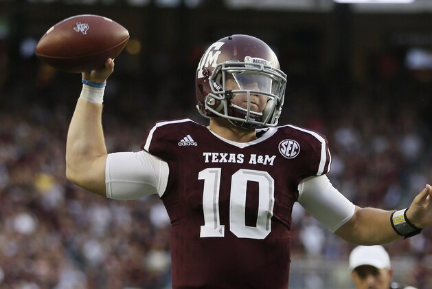 Oct 3, 2015; College Station, TX, USA; Texas A&M Aggies quarterback Kyle Allen (10) throws a touchdown pass to wide receiver Ricky Seals-Jones (not pictured) against the Mississippi State Bulldogs during the first half at Kyle Field. Mandatory Credit: Soobum Im-USA TODAY Sports
