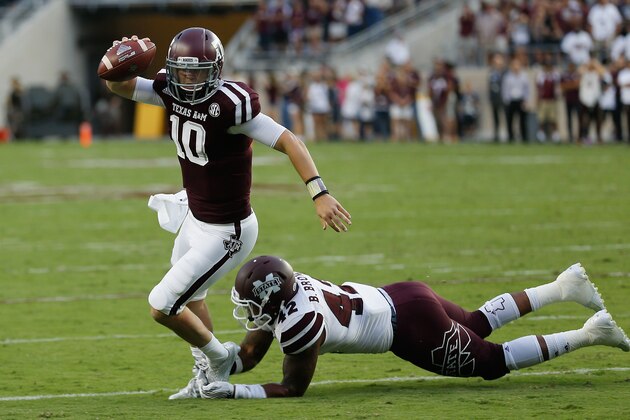 Texas A&M quarterback Kyle Allen (10) avoids the tackle attempt by Mississippi State linebacker Beniquez Brown (42) during the first half of an NCAA college football game, Saturday, Oct. 3, 2015, in College Station, Texas. (AP Photo/Bob Levey)