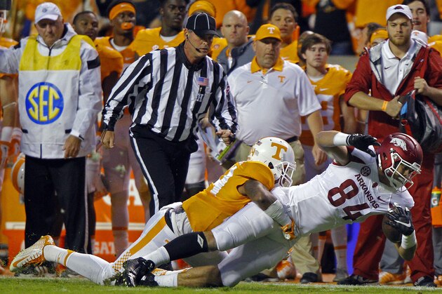 Arkansas tight end Hunter Henry (84) is tackled by Tennessee linebacker Darrin Kirkland Jr. (34) during the first half of an NCAA college football game Saturday, Oct. 3, 2015, in Knoxville, Tenn. (AP Photo/Wade Payne)