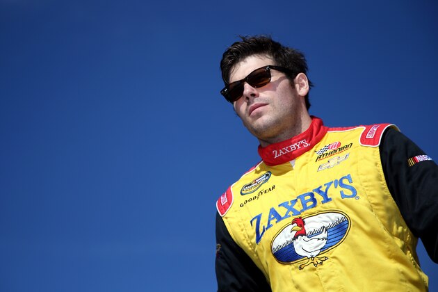 LOUDON, NH - SEPTEMBER 26:  John Wes Townley, driver of the #05 Zaxby's Chevrolet, walks across the stage after being introduced prior to the NASCAR Camping World Truck Series UNOH 175 at New Hampshire Motor Speedway on September 26, 2015 in Loudon, New Hampshire.  (Photo by Sean Gardner/Getty Images)