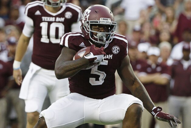 Oct 3, 2015; College Station, TX, USA; Texas A&M Aggies running back Tra Carson (5) carries the ball against the Mississippi State Bulldogs during the first half at Kyle Field. Mandatory Credit: Soobum Im-USA TODAY Sports