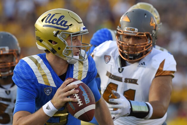 Arizona State linebacker Viliami Latu, right, gets ready to sack UCLA quarterback Josh Rosen for a safety during the first half of an NCAA college football game, Saturday, Oct. 3, 2015, in Pasadena, Calif. (AP Photo/Mark J. Terrill)