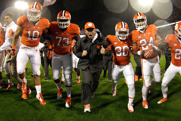 CLEMSON, SC - OCTOBER 3: Head Coach Dabo Swinney of the Clemson Tigers leads his team during warm ups prior to the game against the Notre Dame Fighting Irish at Clemson Memorial Stadium on October 3, 2015 in Clemson, South Carolina. (Photo by Tyler Smith/Getty Images)