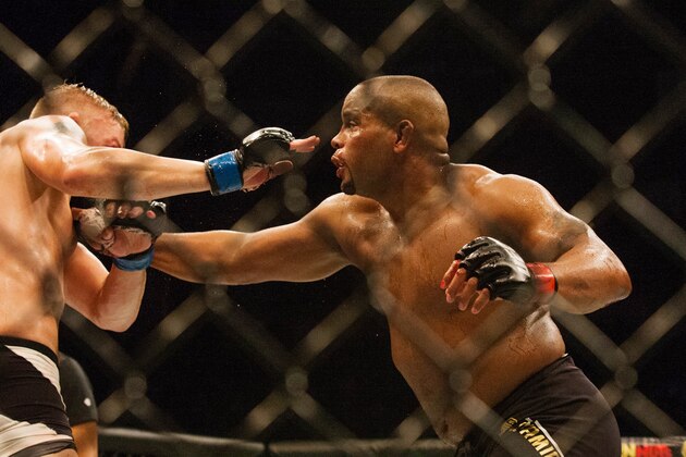 UFC Light Heavyweight champion Daniel Cormier, right, throwing a punch at challenger Alexander Gustasson  during a mixed material arts bout at MMA UFC 192, Saturday, Oct. 3, 2015 in Houston. (AP Photo/Juan DeLeon)