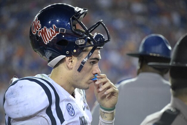 Mississippi quarterback Chad Kelly watches from the sideline at the end of the second half of an NCAA college football game against Florida Saturday, Oct. 3, 2015, in Gainesville, Fla. Florida won 38-10. (AP Photo/Phelan M. Ebenhack)