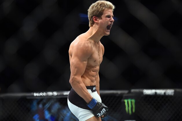 HOUSTON, TX - OCTOBER 03:  Sage Northcutt celebrates after defeating Francisco Trevino in their lightweight bout during the UFC 192 event at the Toyota Center on October 3, 2015 in Houston, Texas. (Photo by Jeff Bottari/Zuffa LLC/Zuffa LLC via Getty Images)
